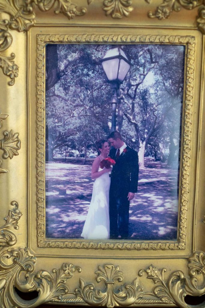 close up of wedding photo in gold picture frame