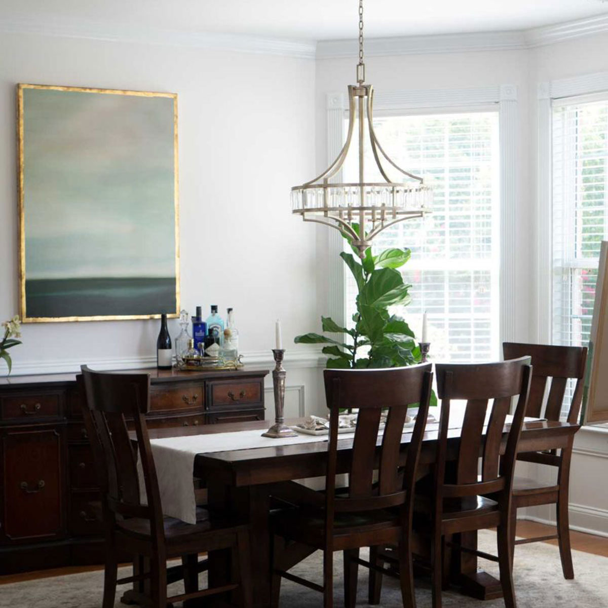 dining room with large painting on wall