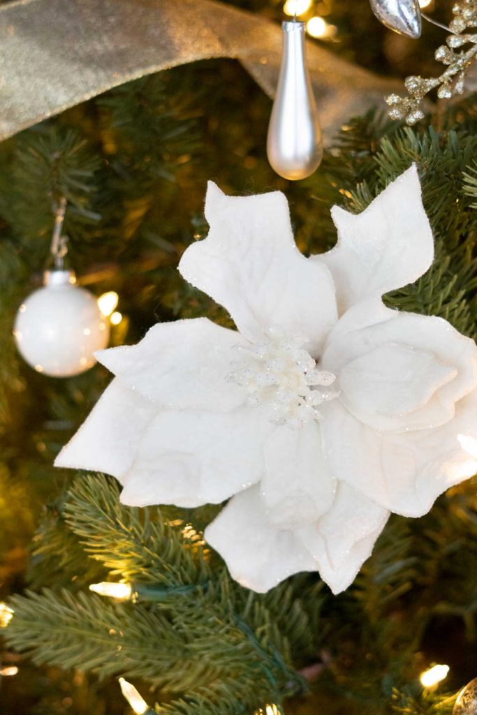 faux white magnolia flowerr in Christmas tree