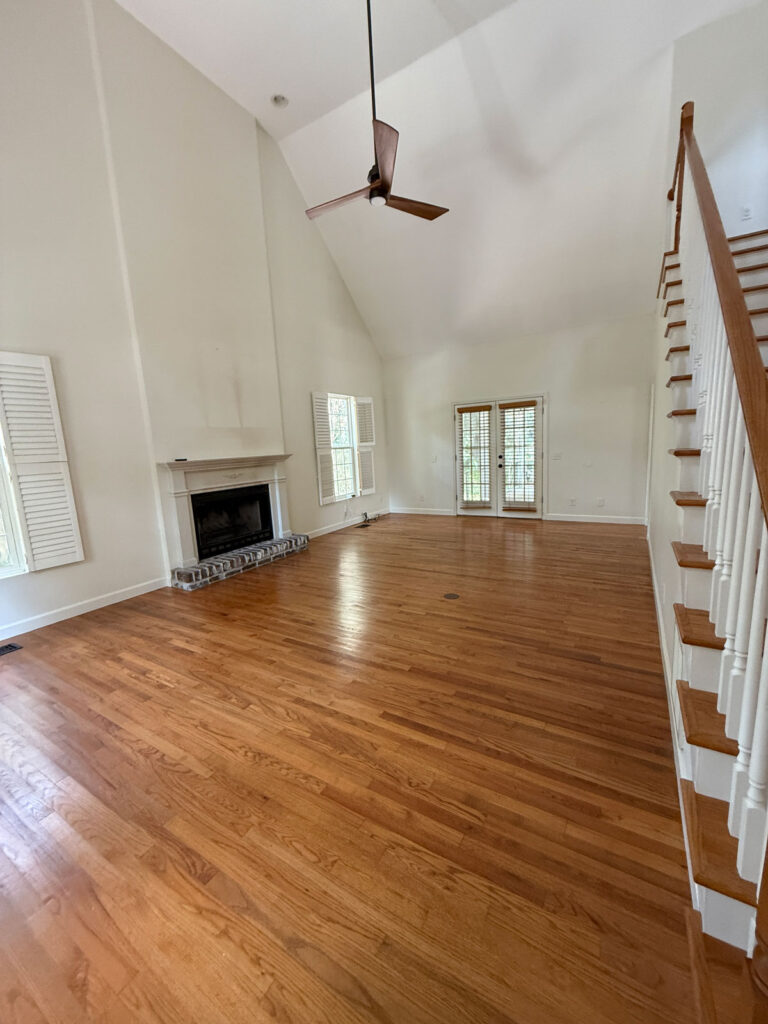 vaulted living room with wood floors