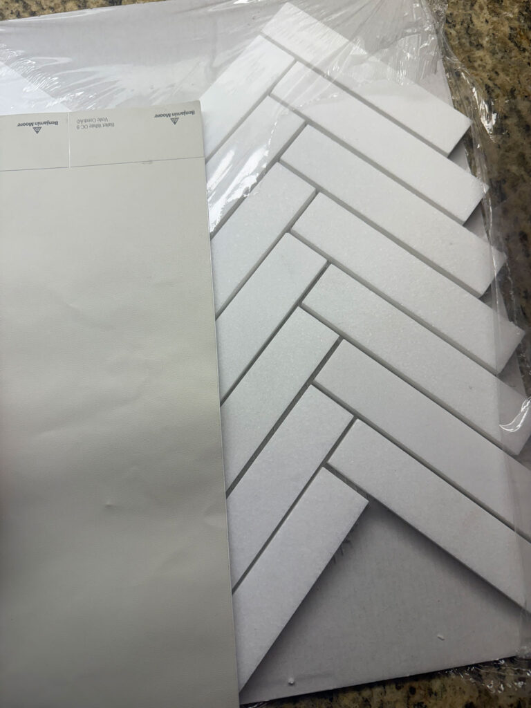 paint swatch and herringbone backsplash tile
