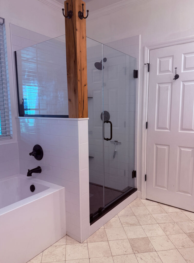 shower enclosure with black fixtures