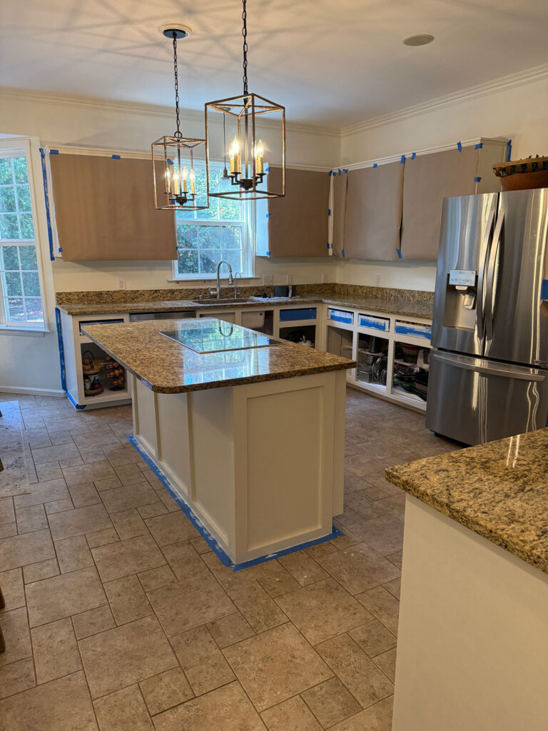 kitchen with white cabinets and brown granite counters