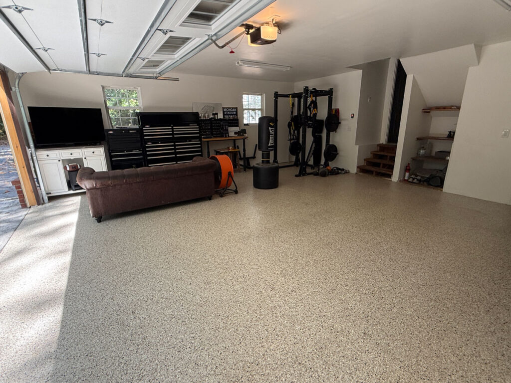 garage with couch and tv and workout area