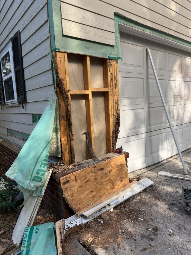 damaged framing around garage
