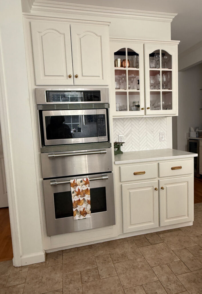 ivory cabinets with wall oven and microwave