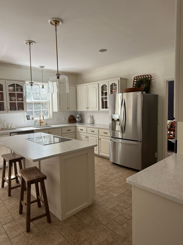 kitchen with ivory cabinets and brushed quartz countertops