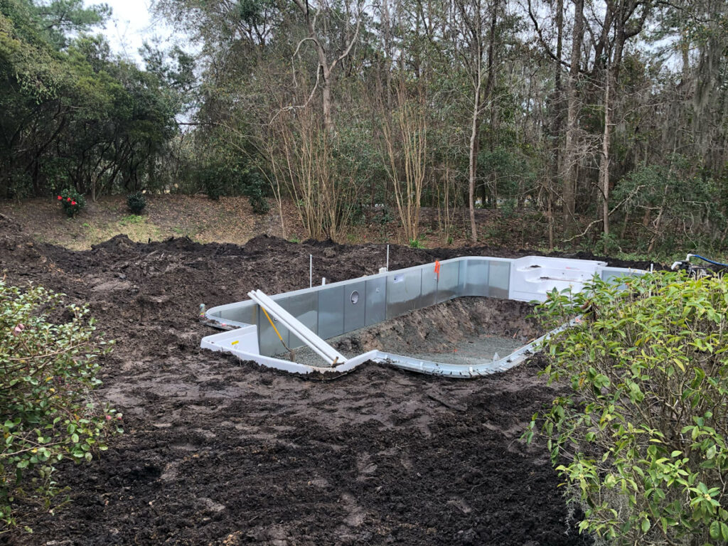 pool construction with torn up yard